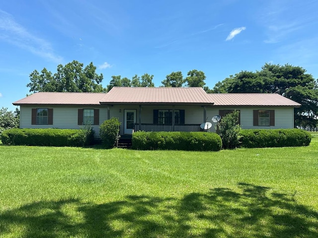 2069 Baker Rd, Coolidge, GA 31757 - ranch-style house featuring covered porch, a front yard, and a metal roof