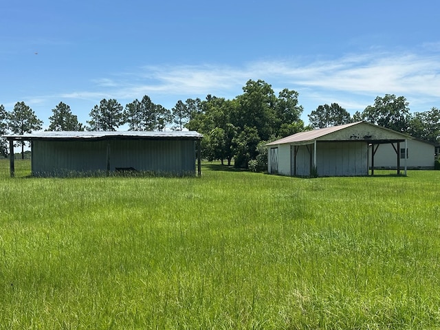 2069 Baker Rd, Coolidge, GA 31757 - view of yard featuring a pole building and an outbuilding