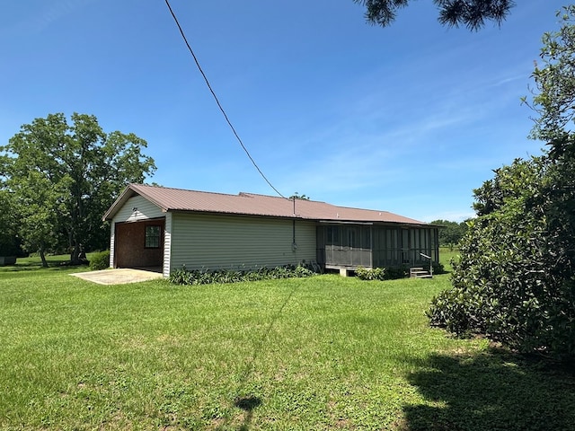 2069 Baker Rd, Coolidge, GA 31757 - back of property featuring a yard, a sunroom, and a metal roof