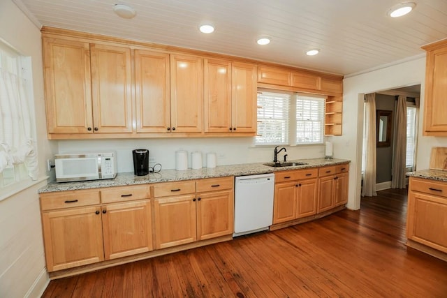 kitchen with white appliances, light stone counters, light brown cabinets, dark wood-style flooring, and a sink