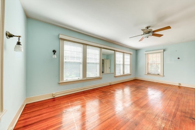 902 SE 2nd St, Moultrie, GA 31776 - spare room with ceiling fan, hardwood / wood-style floors, and baseboards