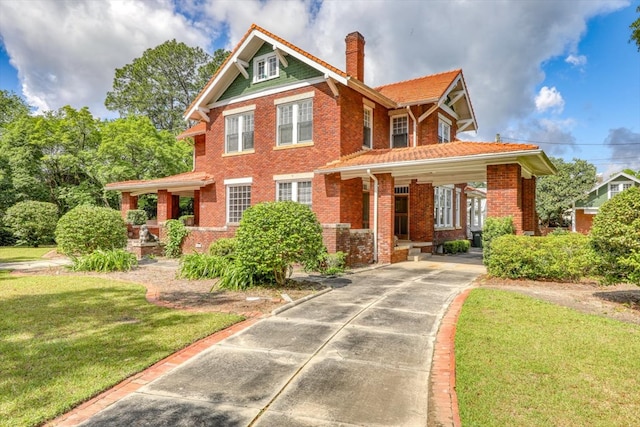 902 SE 2nd St, Moultrie, GA 31776 - view of front of property with brick siding, a front yard, a chimney, and driveway
