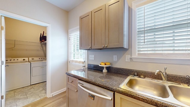 314 Grove Pointe Dr, Thomasville, GA 31792 - kitchen with stainless steel dishwasher, a sink, and washing machine and clothes dryer