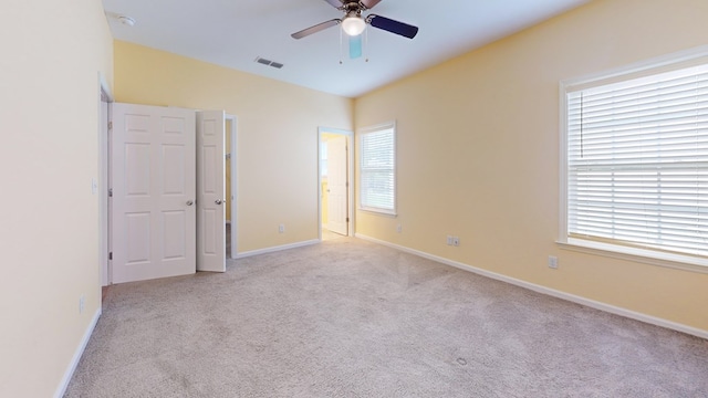 314 Grove Pointe Dr, Thomasville, GA 31792 - unfurnished bedroom with carpet floors, multiple windows, and baseboards
