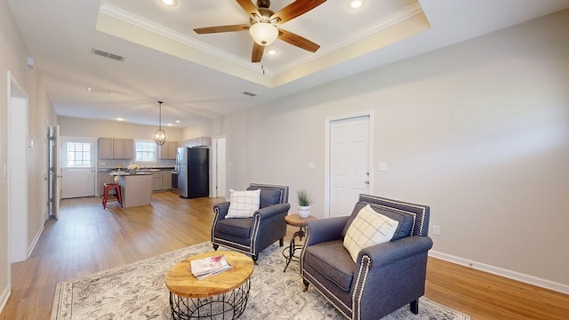 314 Grove Pointe Dr, Thomasville, GA 31792 - living area with light wood finished floors, crown molding, ceiling fan, a tray ceiling, and recessed lighting
