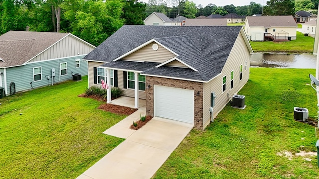 314 Grove Pointe Dr, Thomasville, GA 31792 - view of front of property featuring a shingled roof, central air condition unit, brick siding, and driveway