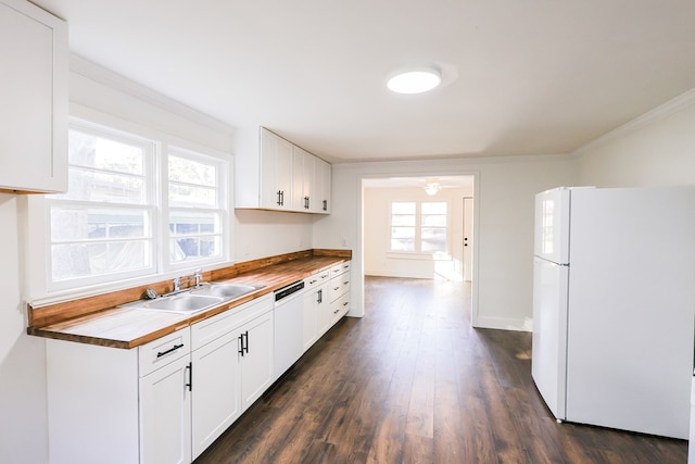101 Hambleton St, Thomasville, GA 31792 - kitchen featuring white appliances, dark wood-style flooring, ornamental molding, white cabinets, and a ceiling fan