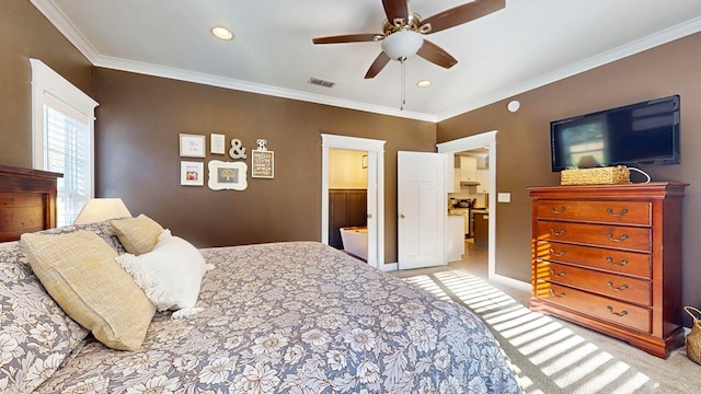 carpeted bedroom with visible vents, crown molding, recessed lighting, ensuite bathroom, and a ceiling fan