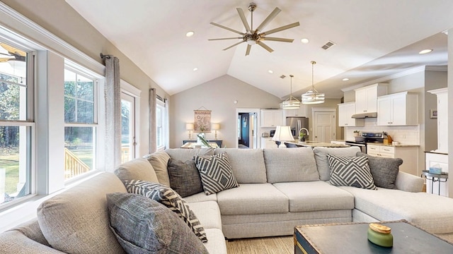 living area with visible vents, a ceiling fan, recessed lighting, light wood-style floors, and lofted ceiling