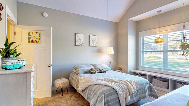 bedroom featuring vaulted ceiling and light colored carpet