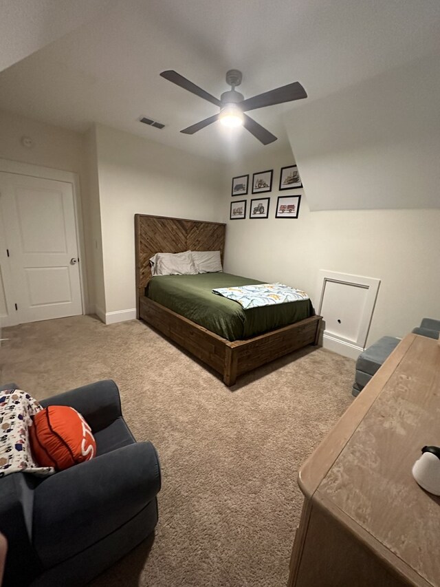 bedroom featuring ceiling fan, lofted ceiling, and carpet floors