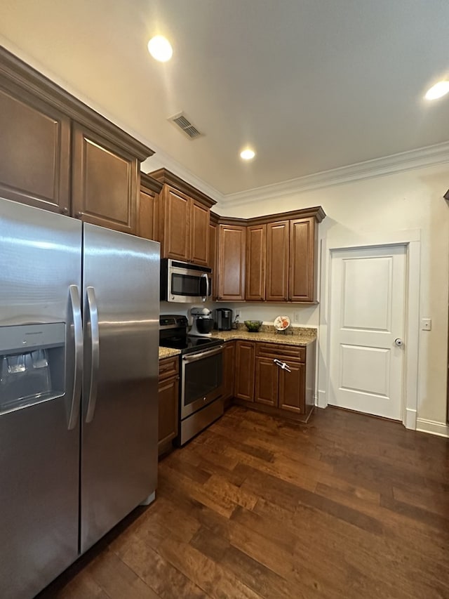 kitchen with stainless steel appliances, ornamental molding, and dark hardwood / wood-style flooring