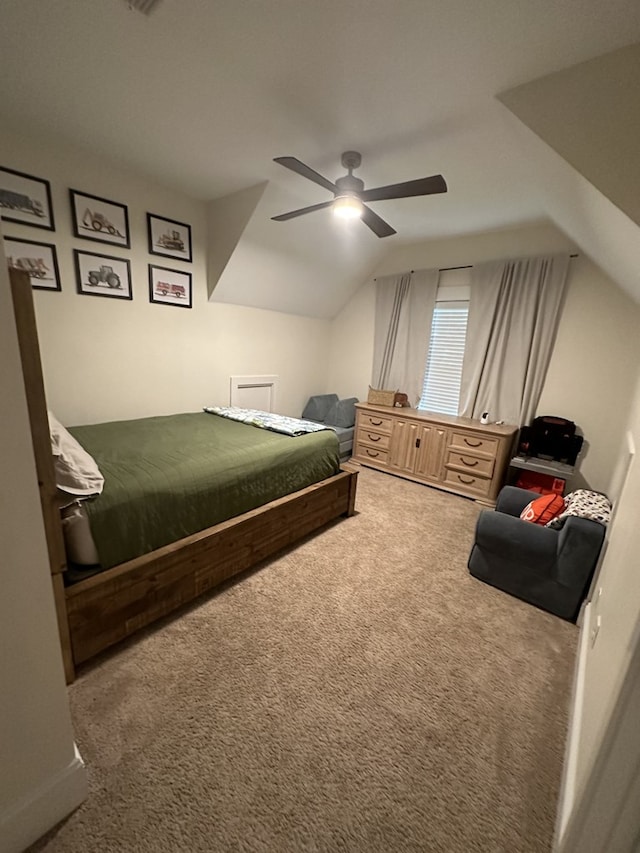 carpeted bedroom featuring vaulted ceiling and ceiling fan