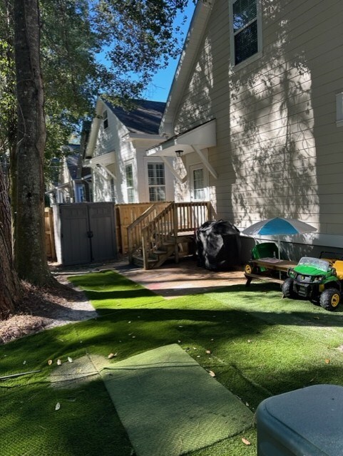 rear view of property featuring a yard