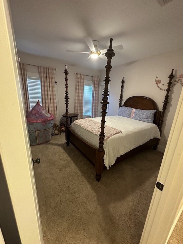 carpeted bedroom with ceiling fan