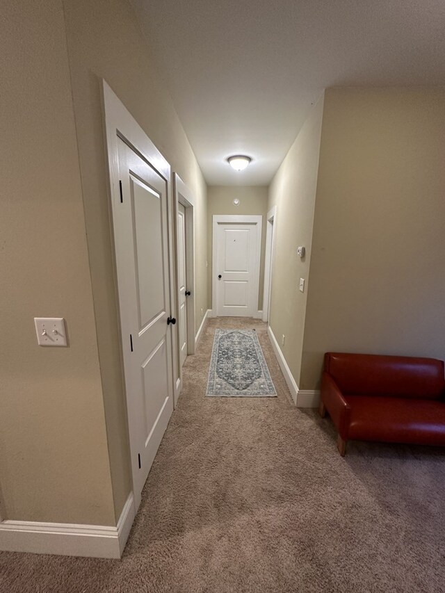 corridor featuring carpet flooring