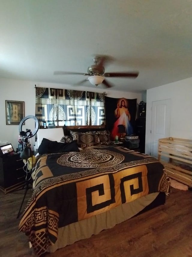 bedroom featuring ceiling fan and wood finished floors