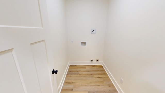 laundry area featuring light wood-type flooring, hookup for an electric dryer, and washer hookup