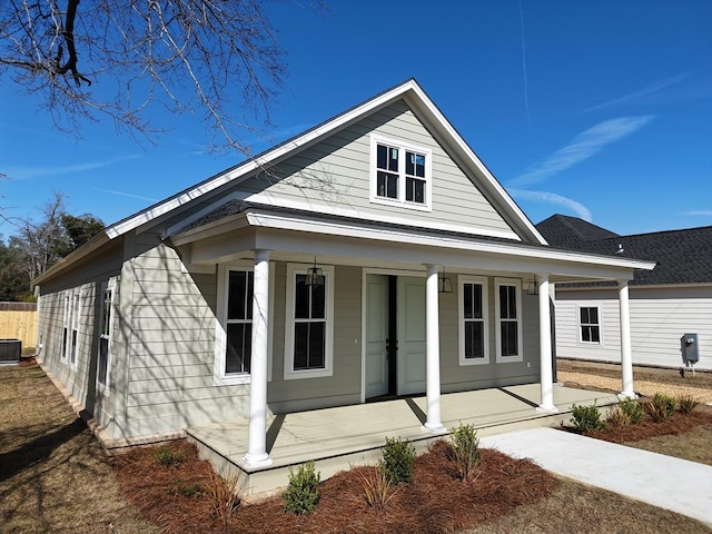 view of front of property featuring central air condition unit and a porch