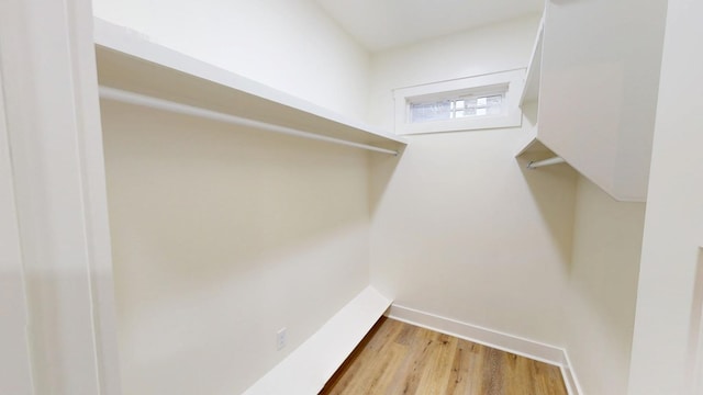 spacious closet featuring hardwood / wood-style flooring