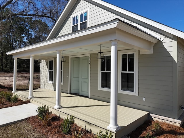 view of property exterior with a porch