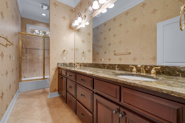 bathroom featuring tile patterned floors, ornamental molding, shower / bath combination with glass door, and vanity