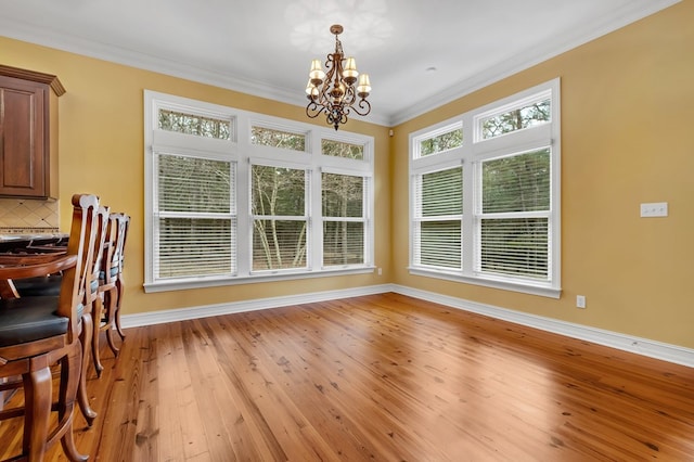 sunroom featuring a chandelier