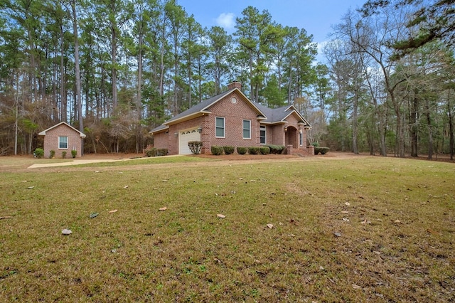 view of front facade with a garage and a front yard