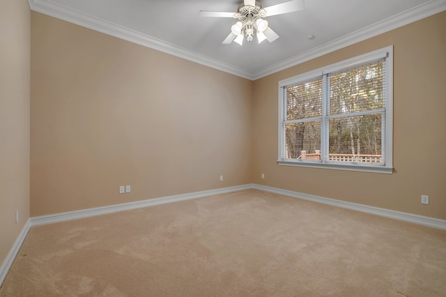 empty room with crown molding, light colored carpet, and ceiling fan