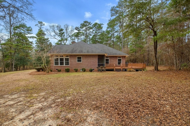 rear view of property with a deck