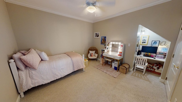 carpeted bedroom featuring crown molding and ceiling fan