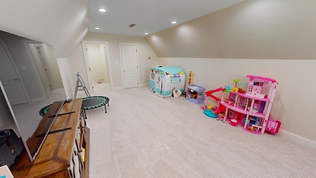 game room featuring lofted ceiling and light carpet