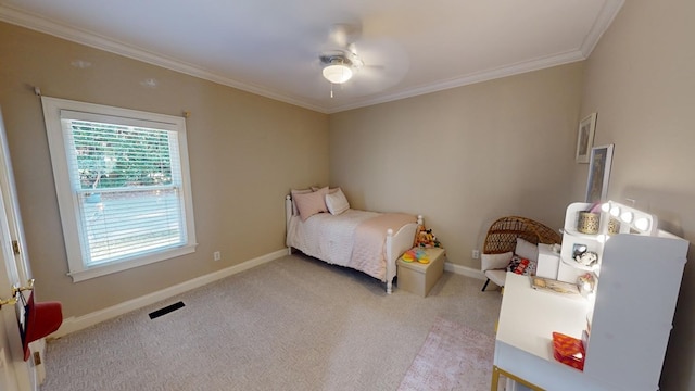 bedroom featuring ornamental molding, light colored carpet, and ceiling fan