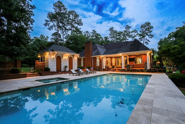 312 Avalon Way, Thomasville, GA 31792 - view of swimming pool featuring a storage structure, an in-ground hot tub, an outbuilding, and a patio