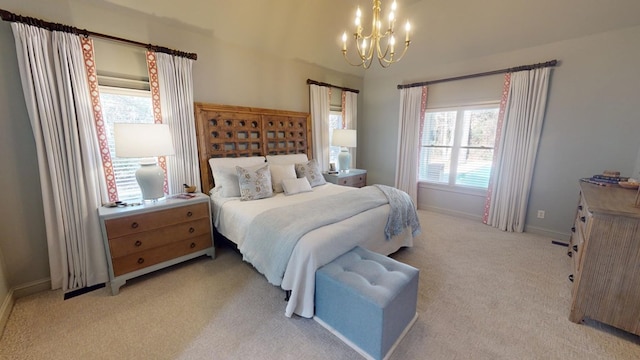 carpeted bedroom with an inviting chandelier