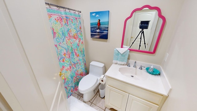 bathroom featuring vanity, curtained shower, and toilet