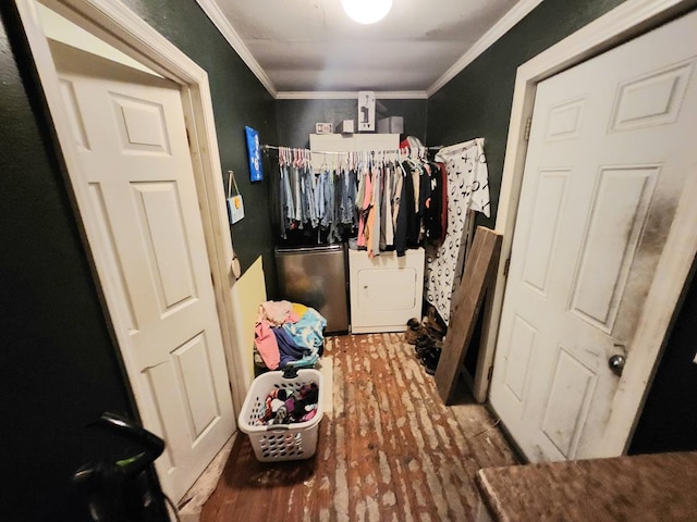 walk in closet with hardwood / wood-style floors and washer / dryer