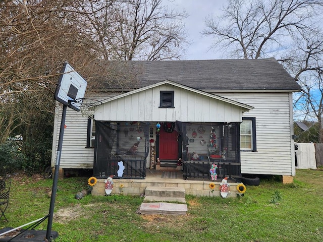 bungalow-style house featuring a front yard