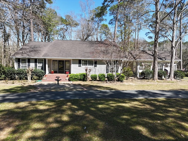 ranch-style house with a front lawn