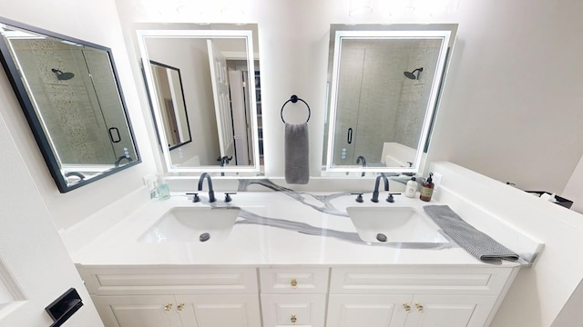 full bath featuring double vanity, a shower stall, and a sink