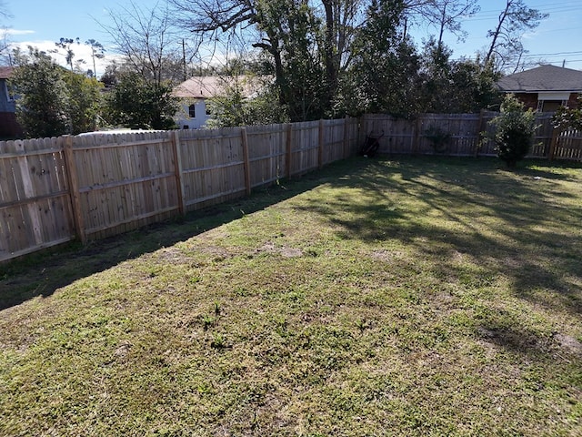 view of yard featuring a fenced backyard