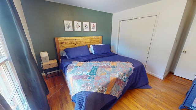 bedroom with a closet and wood finished floors