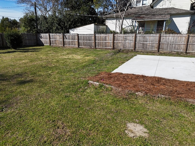 view of yard with a fenced backyard and a patio