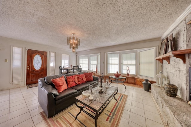 living room with light tile patterned floors, a textured ceiling, ornamental molding, and a chandelier