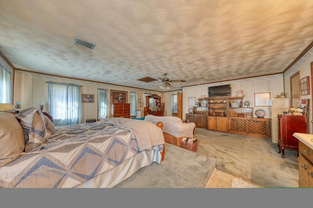 bedroom featuring crown molding and a textured ceiling