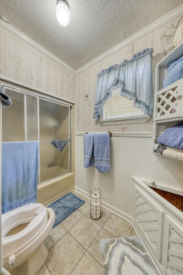 bathroom featuring toilet, a shower, crown molding, a textured ceiling, and tile patterned flooring