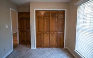 unfurnished bedroom featuring carpet floors and a closet