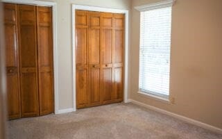 unfurnished bedroom featuring light colored carpet