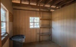 interior space with plenty of natural light and wood walls