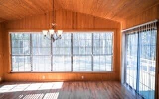 interior space featuring a mail area, wood ceiling, wood-type flooring, a chandelier, and vaulted ceiling